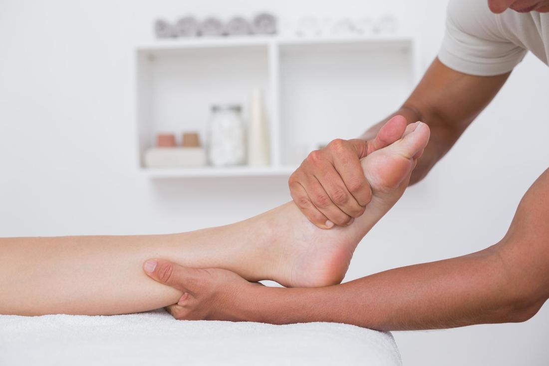 Doctor working for foot pain relief
